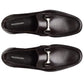 Top view of a pair of Magnanni Gentry Soft Bit Loafers in black leather with silver buckles, placed side by side on a plain white background.