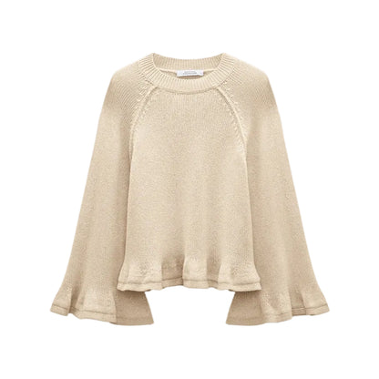 The Cotton Candy Pullover by Dorothee Schumacher is a beige knit cropped top with wide raglan sleeves and a loose, slightly ruffled hem, shown on a white background.
