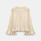 The Dorothee Schumacher Cotton Candy Pullover is a cream-colored cotton sweater featuring long, flared raglan sleeves and a relaxed fit, shown against a plain white background.