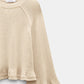 The Dorothee Schumacher Cotton Candy Pullover is a beige cotton top with raglan sleeves and a flared ruffled hem, shown against a plain light background.
