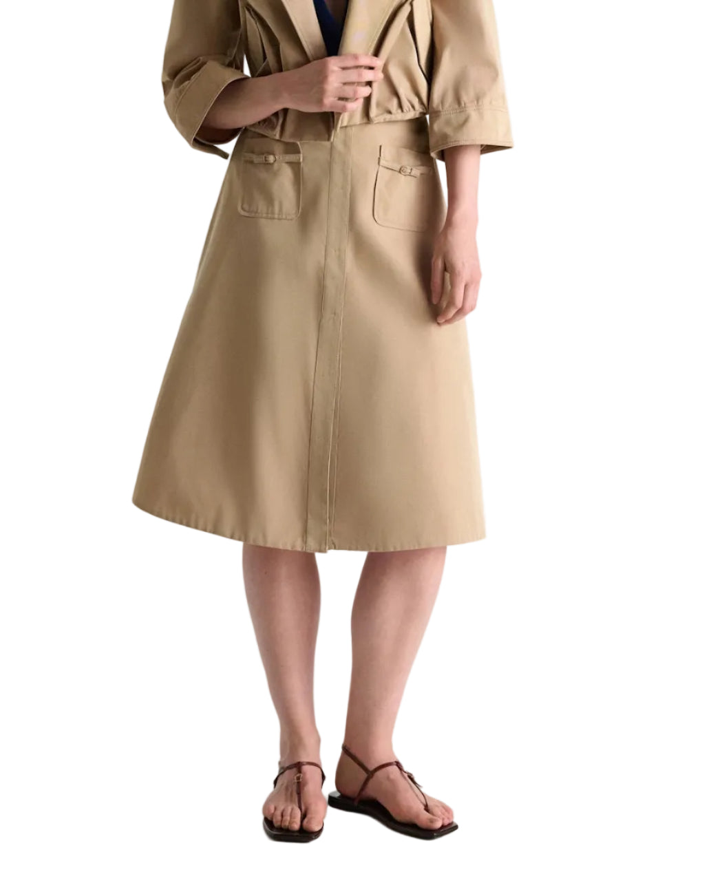 A person models the Dorothee Schumacher Luxury Layer Skirt, paired with black sandals, standing against a white background.