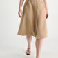 A person in a sleeveless blue top, brown sandals, and the Dorothee Schumacher Luxury Layer Skirt walks forward against a plain light background.