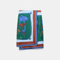 The Cosmic Funghi Skirt by Dorothee Schumacher features a vibrant botanical mushroom print in blue, green, brown, and orange hues. Its rectangular silhouette and contrasting double border evoke the look of a silk twill scarf with a layered hemline, shown laid flat against a plain background.