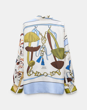 The Cosmic Funghi Blouse by Dorothee Schumacher is an effortless oversized silk twill blouse showcasing a vibrant nature-inspired print of mushrooms, leaves, and decorative ropes on a white background. This striking piece is distinguished by its signature mushroom motif for added charm.