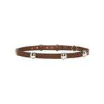 Certainly! Here’s a rewritten sentence using your provided product data: The Dorothee Schumacher True Cuoio Stud Belt is a brown, slim accessory made from soft calfskin, adorned with three evenly spaced silver metal bells and finished with an adjustable pin stud closure.