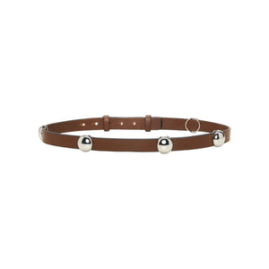 Certainly! Here’s a rewritten sentence using your provided product data: The Dorothee Schumacher True Cuoio Stud Belt is a brown, slim accessory made from soft calfskin, adorned with three evenly spaced silver metal bells and finished with an adjustable pin stud closure.