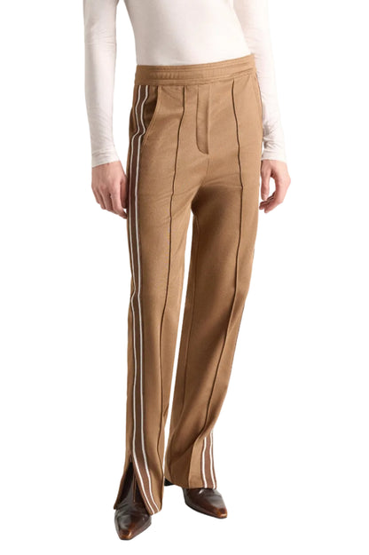 Dorothee Schumacher Everyday Cool Pant in tan quilted knit with a white side stripe, front seams, and small ankle zips at the hem.