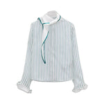 Dorothee Schumacher Stripes With A Twist Blouse, a white long-sleeved striped silk top with a high collar, decorative draped tie, and memory wire cuffs.