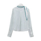 Back view of the white Dorothee Schumacher Stripes With A Twist Blouse featuring thin vertical green stripes, a scarf neckline with a tie detail, and green piping.