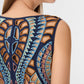 Close-up of a woman's upper back and shoulder wearing the sleeveless Vivienne Brise Dress by Emporio Sirenuse, detailed with colorful, intricate Brisé Cutwork and embroidered patterns.