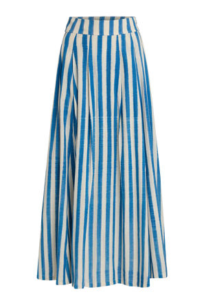 The Flaminia Ikat Stripes Skirt by Emporio Sirenuse is a long, high-waisted design with handwoven blue and white Ikat stripes, a wide waistband, and a flared, flowing silhouette.