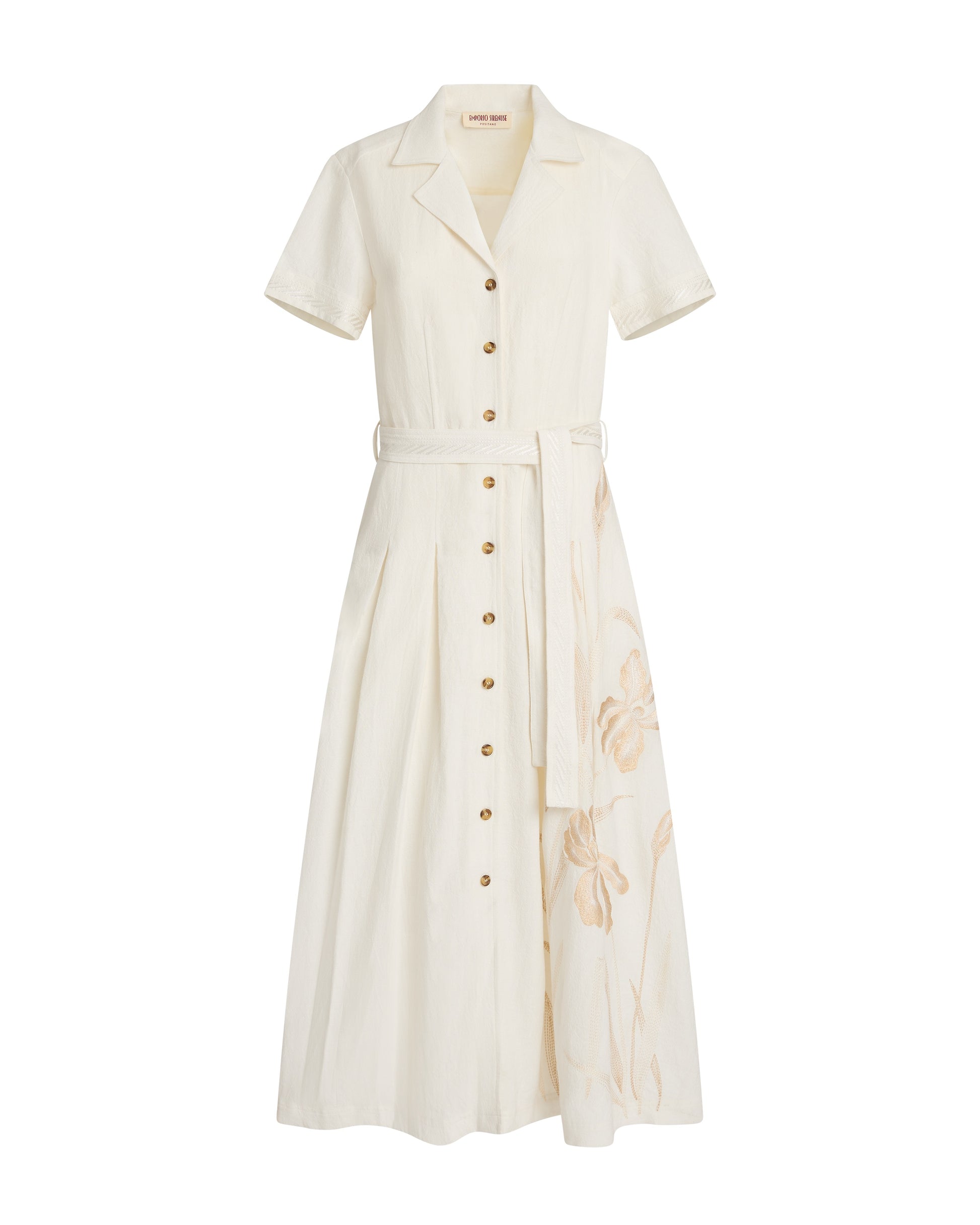 The Daria Sand Flowers Dress by Emporio Sirenuse is an ivory ramie piece with short sleeves, a collar, matching waist belt, and subtle Sand Flowers embroidery on the lower skirt.