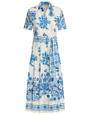 The Emporio Sirenuse Claudia Chintz Dress is a white collared midi dress with short sleeves, a blue botanical and paisley print, button-down front, and matching fabric belt at the waist.