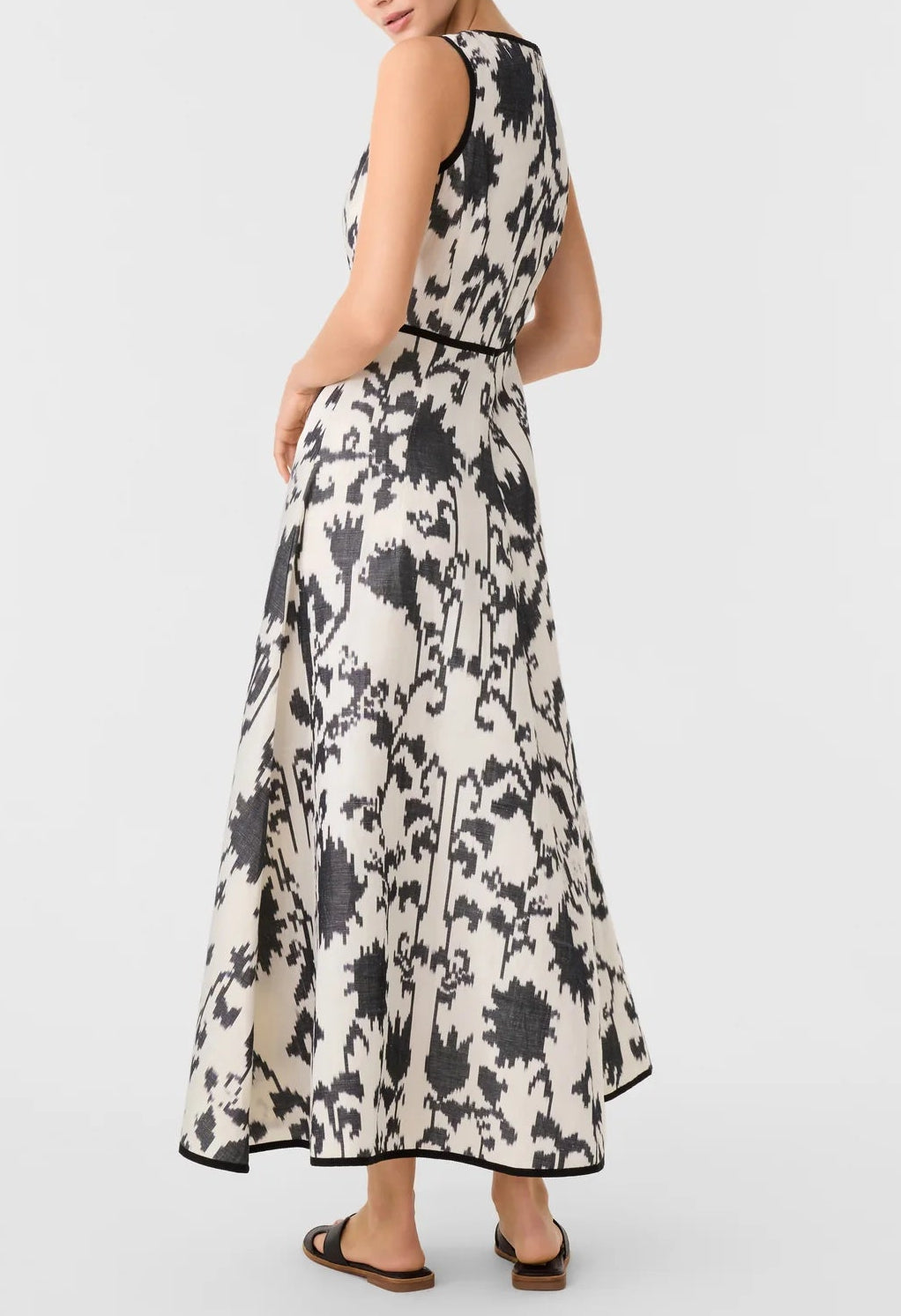 Emporio Sirenuse Clodette Ikat Blossom Dress, a sleeveless, ankle-length monochrome floral dress featuring a black and white ikat pattern with black trim.