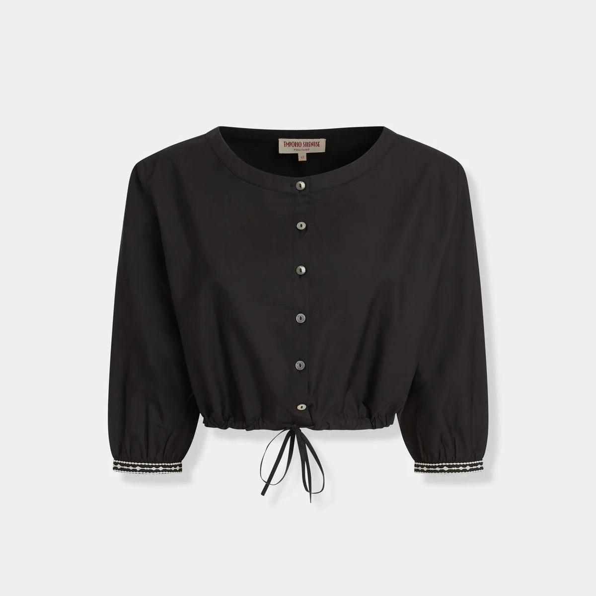 Emporio Sirenuse New Jinny Peony Embroidery Top in black cotton poplin, featuring three-quarter sleeves, an elasticized drawstring waist, and white peony embroidery on the cuffs.