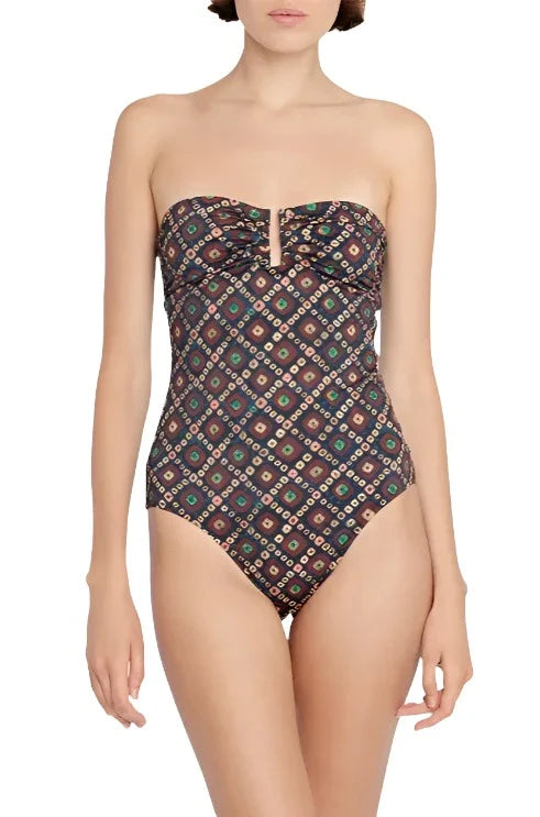 Person wearing an Ulla Johnson Monterey Maillot One Piece, which showcases a strapless design adorned with a geometric pattern in multiple colors and features a subtle sweetheart neckline.