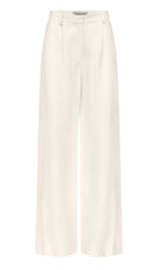 The Taite Pant by TWP features white wide-leg 100% linen trousers with a high waist, front pleats, belt loops, and zip fly closure, shown on a plain background.