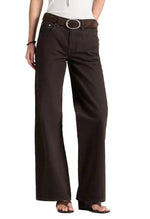 TWP Harvest Moon Jean in dark chocolate denim, featuring a high-waisted, wide-leg fit and a thin brown belt with a silver oval buckle.