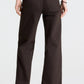 Back view of TWP Harvest Moon Jean in dark chocolate, heavy denim, straight-leg style with a brown suede belt.