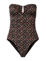 Explore the Ulla Johnson Monterey Maillot One Piece, a strapless swimsuit showcasing an eye-catching geometric pattern in brown, green, and red. Designed with an elegant sweetheart neckline, this exquisite piece seamlessly blends contemporary style with classic sophistication.