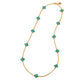 The Juliska Capucine De Wulf Berry Clover Double Sided Necklace features ten turquoise clover charms evenly spaced along a gold station chain, finished with a clasp and a small logo charm.