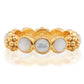 The Berry Gem Ring by Juliska Capucine De Wulf features a row of round white pearls set between clusters of textured gold beads, adding a delicate and elegant touch to any look.
