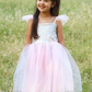 A girl in a Great Pretenders Sequins Princess Dress in lilac.