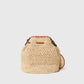 The Falabella Crochet Raffia Bucket Bag by Stella McCartney is a beige woven tote with a rounded bottom, brown leather accents, a top handle, and an attached matching circular pouch.