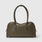 The Ryder Shoulder Bag by Stella McCartney is a vegan olive green bag with two handles, a rounded top, and minimal detailing, shown against a plain light grey background.