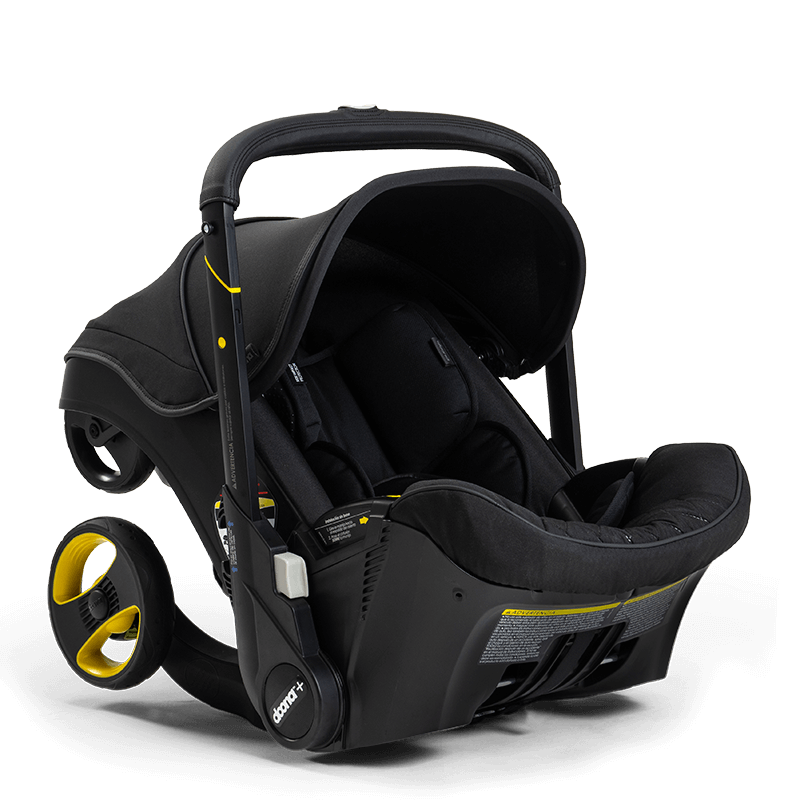 A stylish Doona Car Seat and Stroller, Midnight Edition, in black with three wheels, a sunshade, black fabric, and yellow accents. This sleek Doona provides both style and functionality for on-the-go parents.