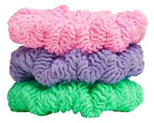 Three Hunza G scrunchies in Bubblegum, Lime, and Lilac are stacked together like a mini set against a white background.