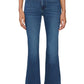 A person wears The Reboot Crop blue bootcut jeans by Frame—ultra-stretchy cotton blend with a cropped inseam—styled with a light gray top, black belt, and black pointed-toe shoes, standing against a plain white background.