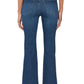 A person wearing a grey top, black heeled shoes, and Frame’s The Reboot Crop jeans in blue—featuring a cropped inseam and ultra-stretchy cotton blend—is seen from the back against a white background.