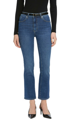 Person wearing a black long-sleeve top, The Reboot Crop high-waisted jeans by Frame with a black belt, and black pointed-toe heels.