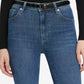 A person wearing Frame's The Reboot Crop high-waisted, ankle-length jeans with a black belt and long-sleeve black top, shown from waist to mid-thigh.