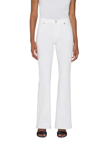 A person wearing The Icon white full-length flare jeans by Frame, a white sleeveless top, and black open-toe sandals, standing against a plain background.