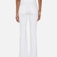 A person stands facing away against a plain background, wearing The Icon super-stretch flare jeans in white by Frame and a matching white top, with arms relaxed at their sides.