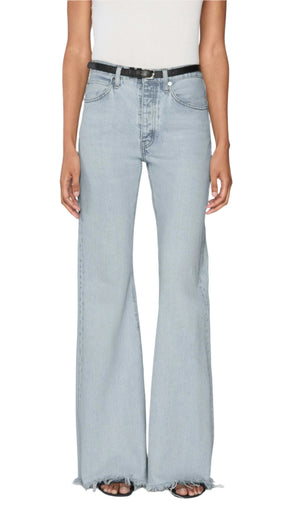A person wearing The Lax high-waisted wide-leg flare jeans by Frame with frayed hems, styled with a black belt and white top for a vintage vibe.