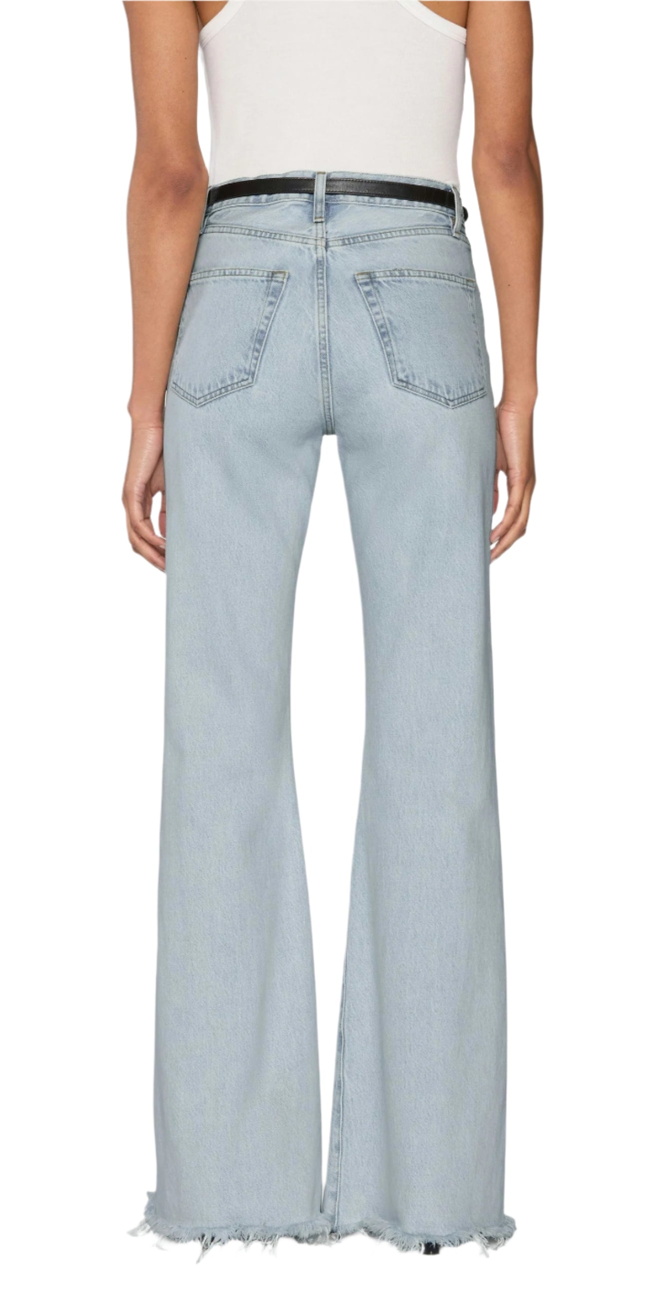 Person wearing Frame’s The Lax light blue high-waisted, wide-leg flare jeans in rigid denim with frayed hems, styled with a black belt and white sleeveless top, photographed from the back for a vintage look.