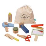 The Manhattan Toy Style & Groom set by Manhattan Toy is perfect for imaginative role-play, featuring a hairdryer, scissors, mirror, combs, shampoo, and a drawstring storage bag. It's an ideal grooming playset for kids who love to pretend and explore.