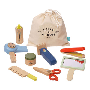 The Manhattan Toy Style & Groom set by Manhattan Toy is perfect for imaginative role-play, featuring a hairdryer, scissors, mirror, combs, shampoo, and a drawstring storage bag. It's an ideal grooming playset for kids who love to pretend and explore.