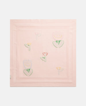The Baby Knit Floral Blanket by Stella McCartney Kids is a light pink, square, lightweight blanket with embroidered pastel flowers in a simple center pattern.