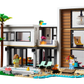 The LEGO® Creator Modern House by Legos - Toyhouse includes a stylish palm tree, sparkling pool, two cozy lounge chairs, and a charming fire pit. This set comes with two minifigures for imaginative play.