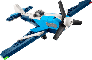 The Legos - Toyhouse LEGO® Creator 3-in-1 Creator Aircraft: Race Plane features a blue and white design with a black propeller and green wingtip detail, pictured on a plain background.