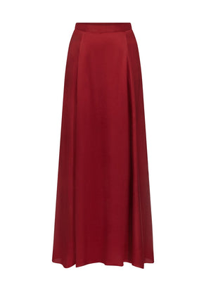 The TWP Flowy Maxi Skirt is a high-waisted, deep red satin A-line skirt with a flared silhouette, displayed on a plain white background.