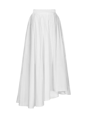 The TWP Asymmetrical A-Line Skirt is a white, high-waisted midi made from 100% cotton, featuring a flared and flowing silhouette.