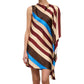 A woman wearing the Staud Sabina Silk Dress, an easy-fit column style with a sleeveless, asymmetrical silhouette and diagonal stripes in brown, cream, burgundy, and blue on printed stretch silk satin, stands against a white background.