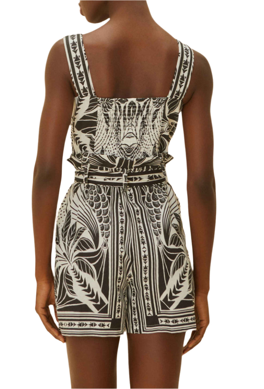 A person, seen from the back, exudes monochrome elegance in the Farm Rio Monochrome Elegance Scarf Off White Romper.