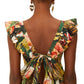 A woman with a bun and heart-shaped earrings is seen from behind wearing the Farm Rio Botanical Forest Multicolor Scoop Neck Ruffled Strap Dress.