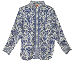 The Blue Tropical Cameo Off-White Pajama Shirt by Farm Rio features blue and white paisley and floral prints, crafted from LENZING™ ECOVERO™ eco-responsible fibers, shown flat on a white background.